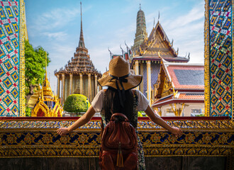 Asian woman traveller take a photo and travel in Bangkok grand palace and wat phra kaew in Bangkok city