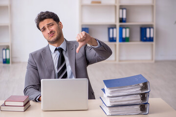 Young male employee working in the office