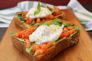 Tasty and Healthy Fresh Tomato and Basil Toast Topped with Poached Egg