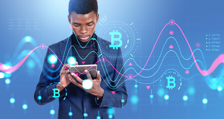 African businessman using tablet in hands, bitcoin chart with ca
