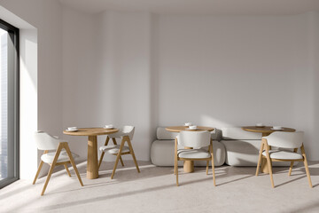 Minimalistic white cafe interior with sofa