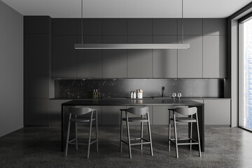 Dark gray kitchen interior with bar