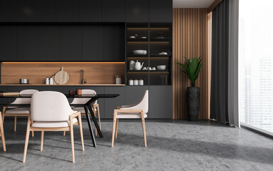 Gray and wooden kitchen with cupboard and table