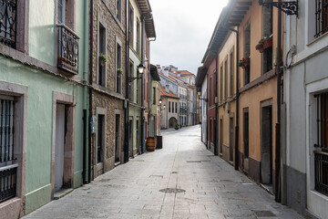 Picturesque alley with colorful houses in the fishing village by the sea, Luanco, Asturias.