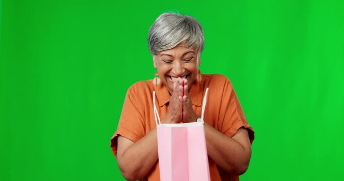 Happy, Surprised And A Woman With A Gift On A Green Screen Isolated On A Studio Background. Smile, Birthday And An Excited Senior Lady Opening A Present With Shock And Happiness On A Backdrop