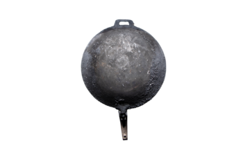Black soot on bottom of old pan that has been heated for long time hung on wall fence galvanized sheet. Hanging and waiting to cook in kitchen in countryside of Thailand. Isolated on cutout PNG.