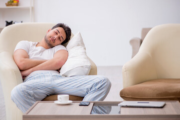 Fototapeta premium Young man starting day at home