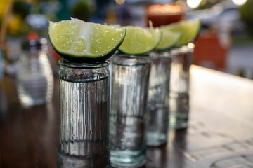 Lime on top of a tequila shot