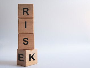 risk and rise inscription on wooden blocks.
risk management idea concept.