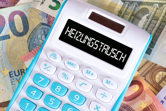 Euro Banknoten, Taschenrechner und Kosten f&uuml;r Heizungstausch