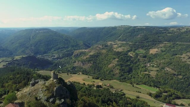 Slow motion aerial of the historical ruins and surrounding landscape of Saint Privat d'Allier