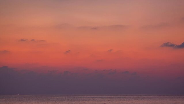 time lapse sweet sky in twi.aerial view stunning sky in sunset above the sea..colorful cloud in bright sky of sunset above the ocean at Khao Khad Phuket. .Majestic sunset or sunriselight over the sea.