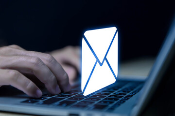 Businessman sending a letter from a laptop. electronic mail concept is online communication on the...