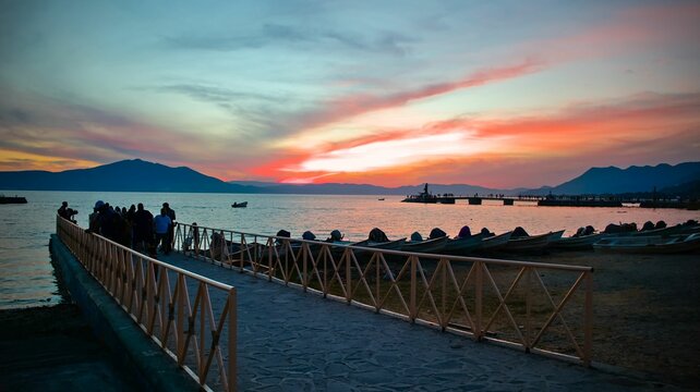 Fototapeta Landscape of a group of people near Lake Chapala during the sunset in Mexico