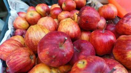 Red apples on village bazaar bench illustration image. Organic red apples close up.