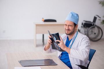 Young male doctor radiologist working in the clinic