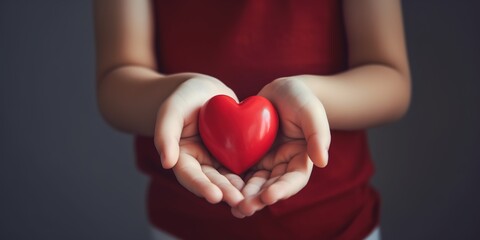 Fototapeta premium Child hands holding red heart,health care, donate and family insurance concept,world heart day, world health day, CSR responsibility, adoption foster family, hope, gratitude, kind, generative ai