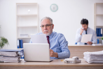 Two male colleagues working in the office