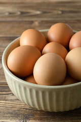 eggs in a bowl on wooden table