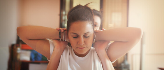 A beautiful masseuse performs massage therapy in a private SPA center while a beautiful woman...