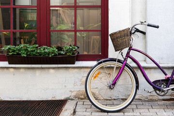 Fototapeta na wymiar Vintage bicycle parked near old house in little European town