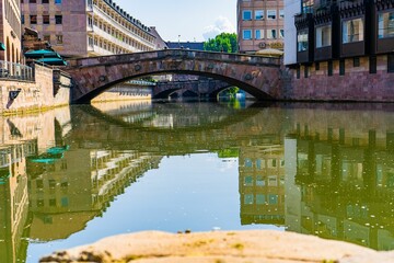 Stone bridge over a green river in downtown Nuernberg