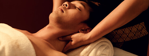 Aromatherapy massage, Masseuse hand massage aroma on neck and shoulder a man customer in...