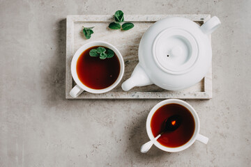 Obraz na płótnie Canvas Two cups of tea and a teapot.