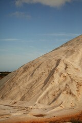 Vertical shot of Faro salt flats where sea salt is made and harvested in a rural area