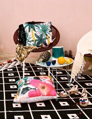 Outdoor chill area with retro chairs and carpet