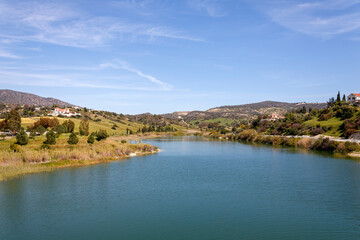Fototapeta na wymiar Germasogeia water reservoir in springtime, Cyprus