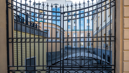 Metal gates at the entrance to the courtyard of the house.