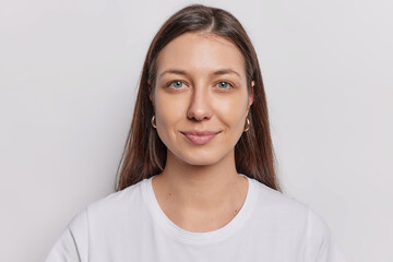 Portrait of good looking brunette woman with natural eauty healthy skin straight hair looks...