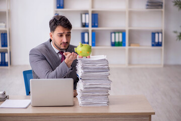 Young male employee in planning retirement concept