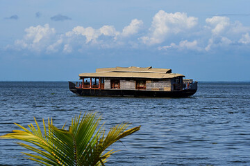 Houseboat in a lake in Kerala. Sustainable tourism. 