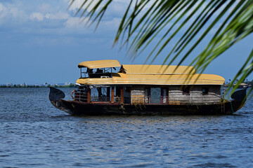 A houseboat in the lake in Kerala. Sustainable tourism.