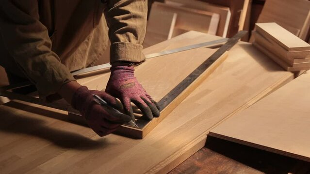 Hand of old masters on board from oak sawdust