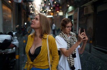 Two female tourists exploring the old town.