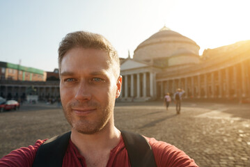 Male tourist taking selfie on Piazza del Plebiscito.