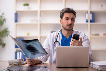 Young male doctor radiologist working in the clinic