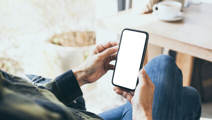 cell phone blank white screen mockup.hand holding texting using mobile on desk at office.background empty space for advertise.work people contact marketing business,technology
