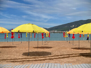 Empty sand beach with umbrella on Turkish resort, consequences of the pandemic