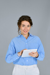 Young smart professional business woman office worker holding digital tablet, using tab computer...