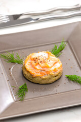 salty cake filled with cream cheese served with smoked salmon and dill
