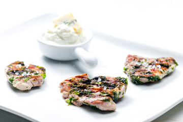 grilled poultry meat with herbs served with blue cheese dip