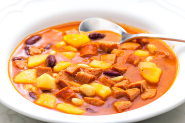 sausage goulash soup with potatoes and beans