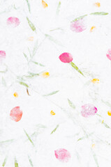 Obraz na płótnie Canvas The Handmade recycled flower and leaf paper background.