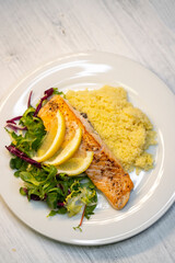 salmon fillet with couscous and vegetables salad