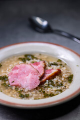 broth with smoked meat and groats