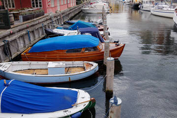 Fototapeta na wymiar Top view group of small boats docks on the canal in Copenhagen, Denmark in autumn season.